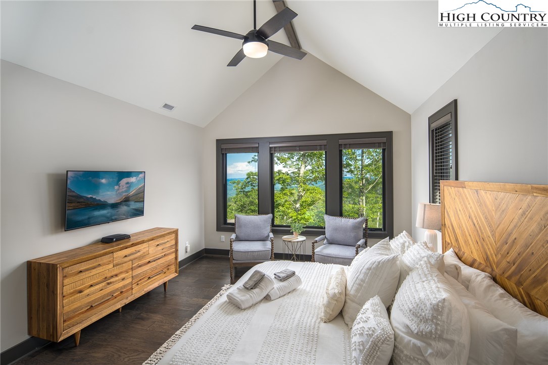 137 Sweetspire Lane Boone, NC 28607 - Photo 14 of 50 a bedroom with furniture and a flat screen tv