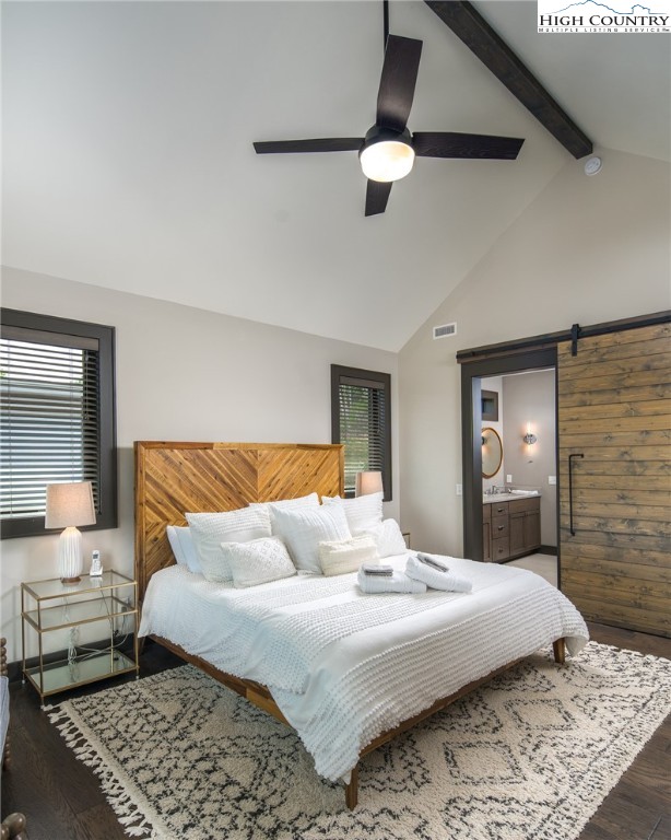 137 Sweetspire Lane Boone, NC 28607 - Photo 15 of 50 a bedroom with a large bed and a chandelier