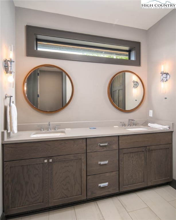 137 Sweetspire Lane Boone, NC 28607 - Photo 16 of 50 a bathroom with a sink and a mirror
