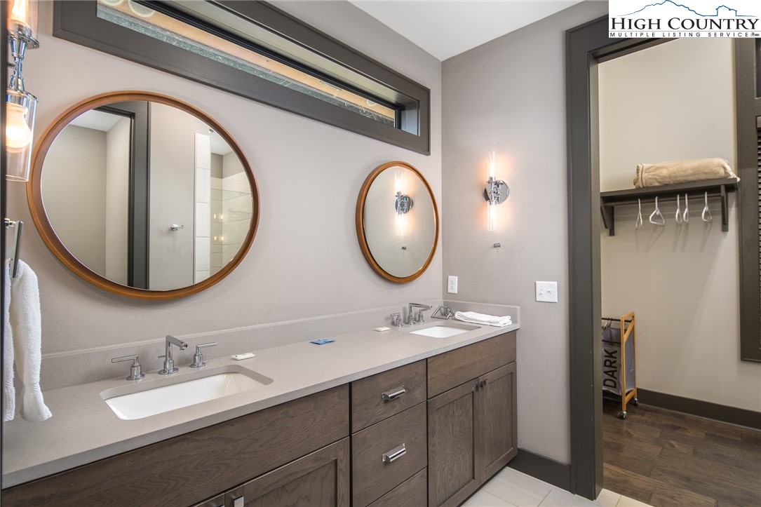 137 Sweetspire Lane Boone, NC 28607 - Photo 17 of 50 a bathroom with a double vanity sink and a mirror