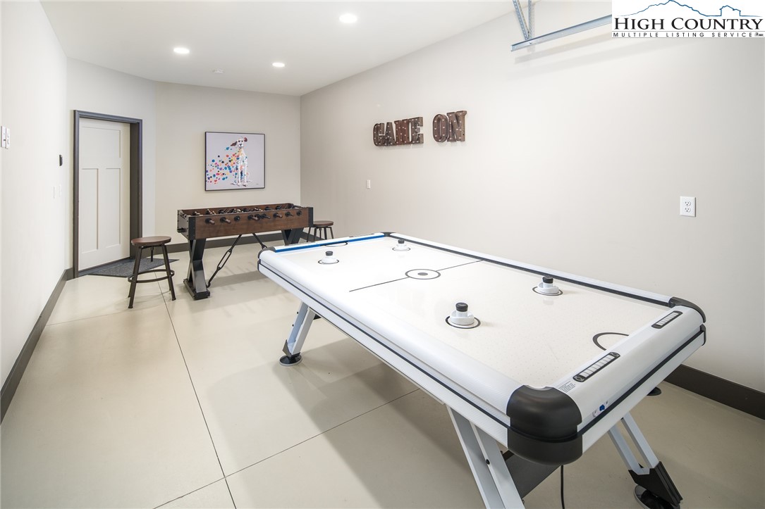 137 Sweetspire Lane Boone, NC 28607 - Photo 27 of 50 a room with furniture and air hockey table