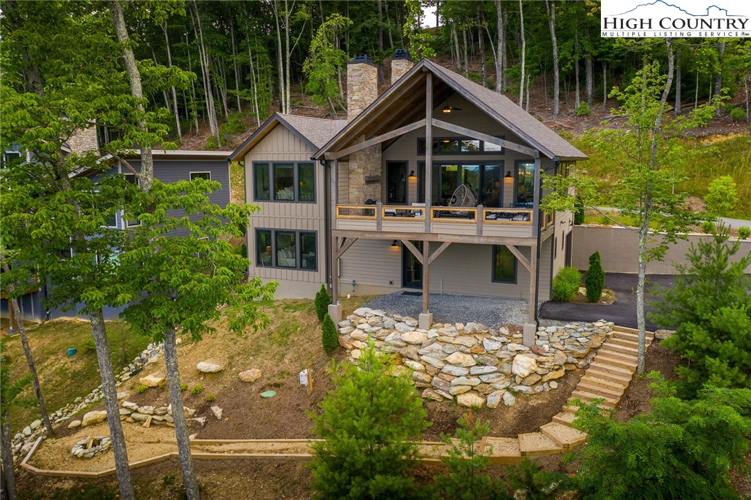 137 Sweetspire Lane Boone, NC 28607 - Photo 29 of 50 a front view of a house with garden