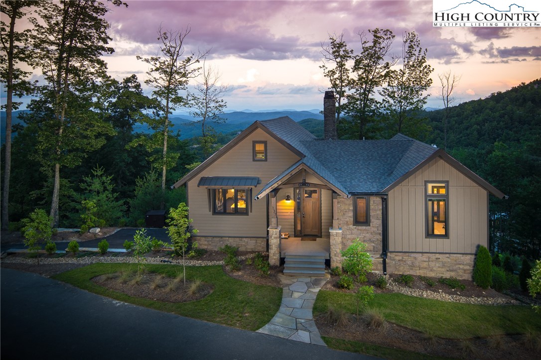 137 Sweetspire Lane Boone, NC 28607 - Photo 37 of 50 a front view of a house with garden