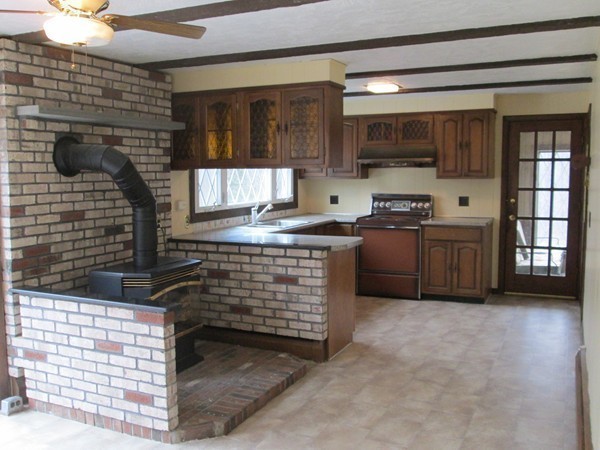 124 East County Road Rutland, MA 01543 - Photo 13 of 22 a kitchen with stainless steel appliances kitchen island granite countertop a stove a sink and a microwave