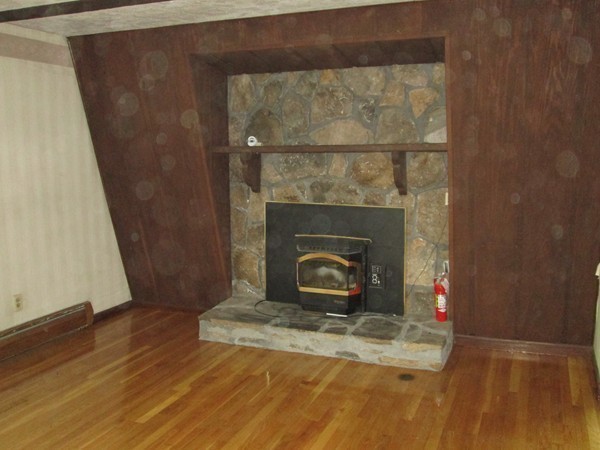 124 East County Road Rutland, MA 01543 - Photo 17 of 22 a room with a fireplace