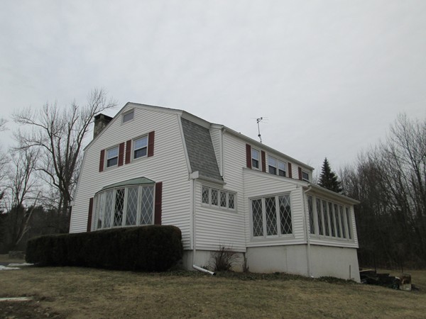 124 East County Road Rutland, MA 01543 - Photo 3 of 22 a front view of a house with a garden