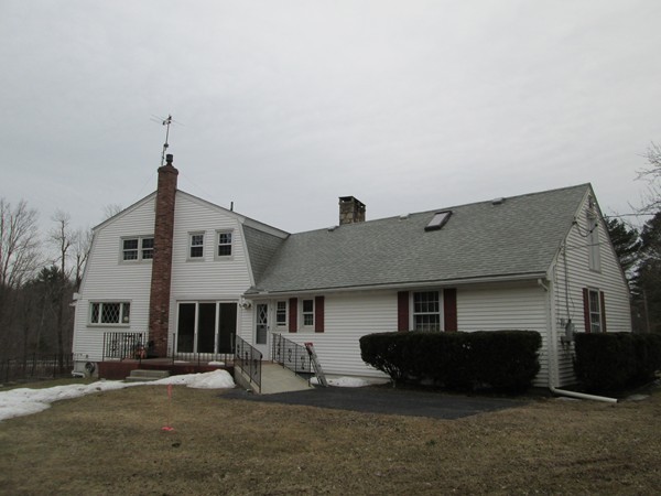 124 East County Road Rutland, MA 01543 - Photo 5 of 22 a front view of a house with a yard