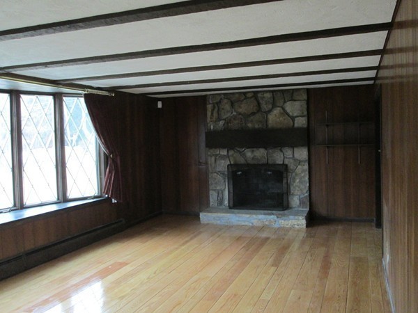 124 East County Road Rutland, MA 01543 - Photo 6 of 22 a view of a fireplace in an empty room