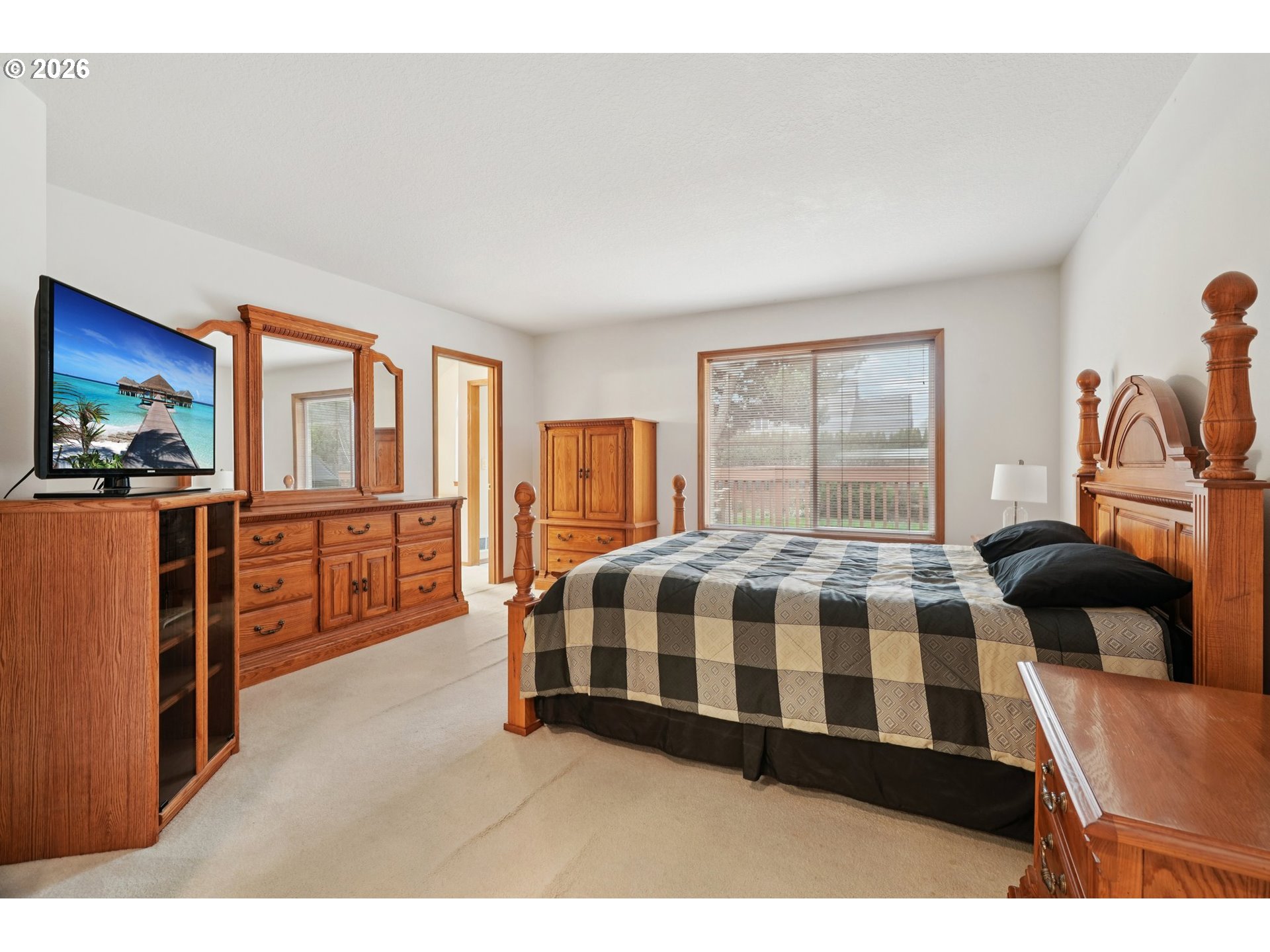 19862 Castleberry Loop Oregon City, OR 97045 - Photo 16 of 33 a bedroom with a bed and wooden floor