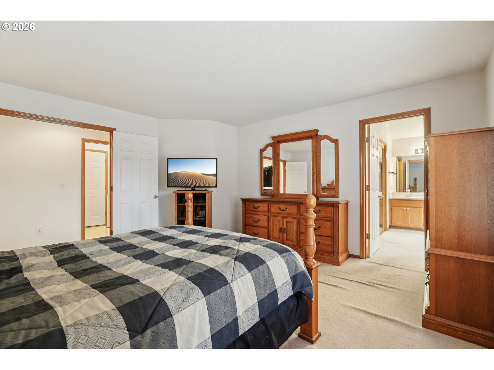 19862 Castleberry Loop Oregon City, OR 97045 - Photo 18 of 33 a bedroom with a bed and a refrigerator