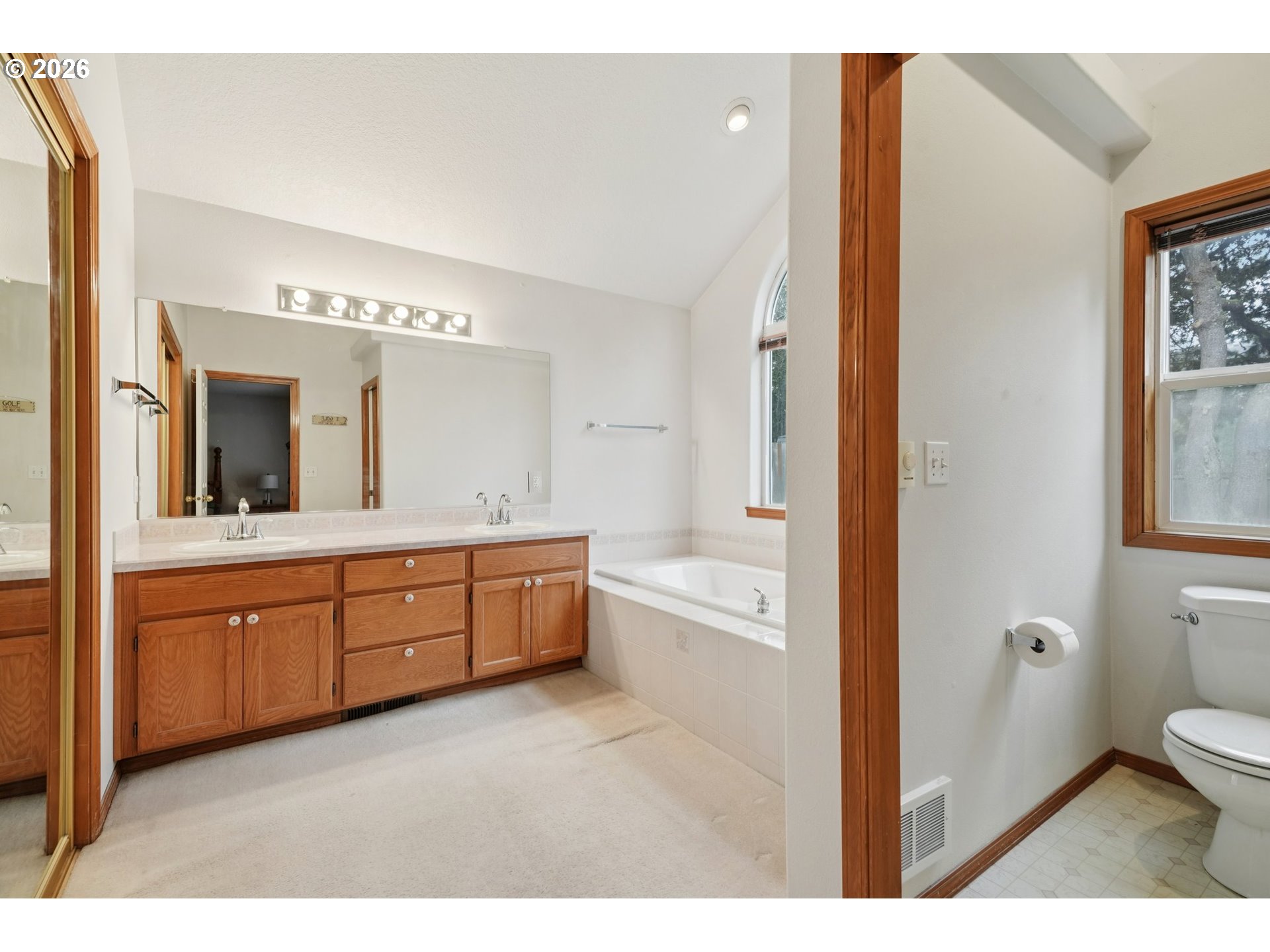 19862 Castleberry Loop Oregon City, OR 97045 - Photo 20 of 33 a spacious bathroom with a granite countertop sink mirror and a bathtub