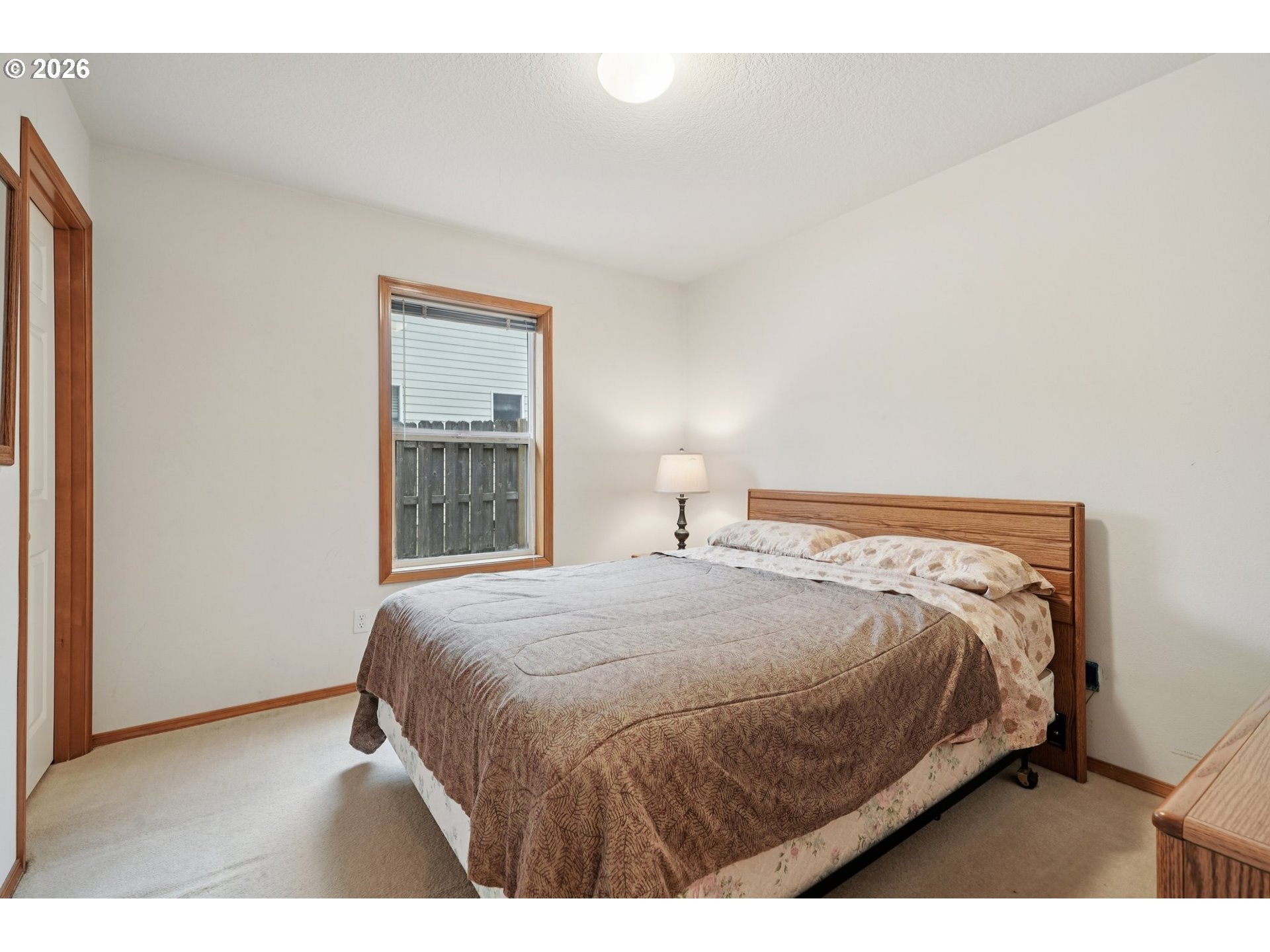 19862 Castleberry Loop Oregon City, OR 97045 - Photo 21 of 33 a bedroom with a bed and a window