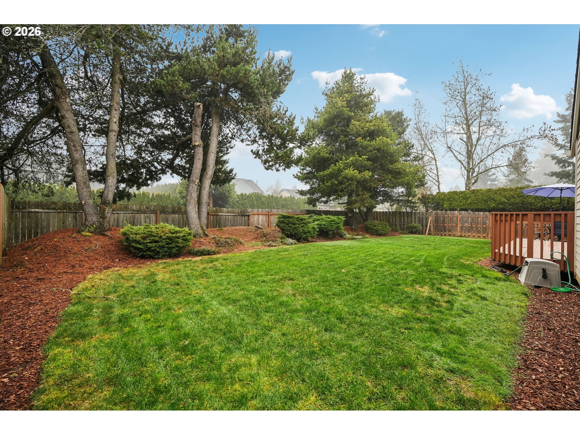 19862 Castleberry Loop Oregon City, OR 97045 - Photo 30 of 33 a view of a garden with a fountain