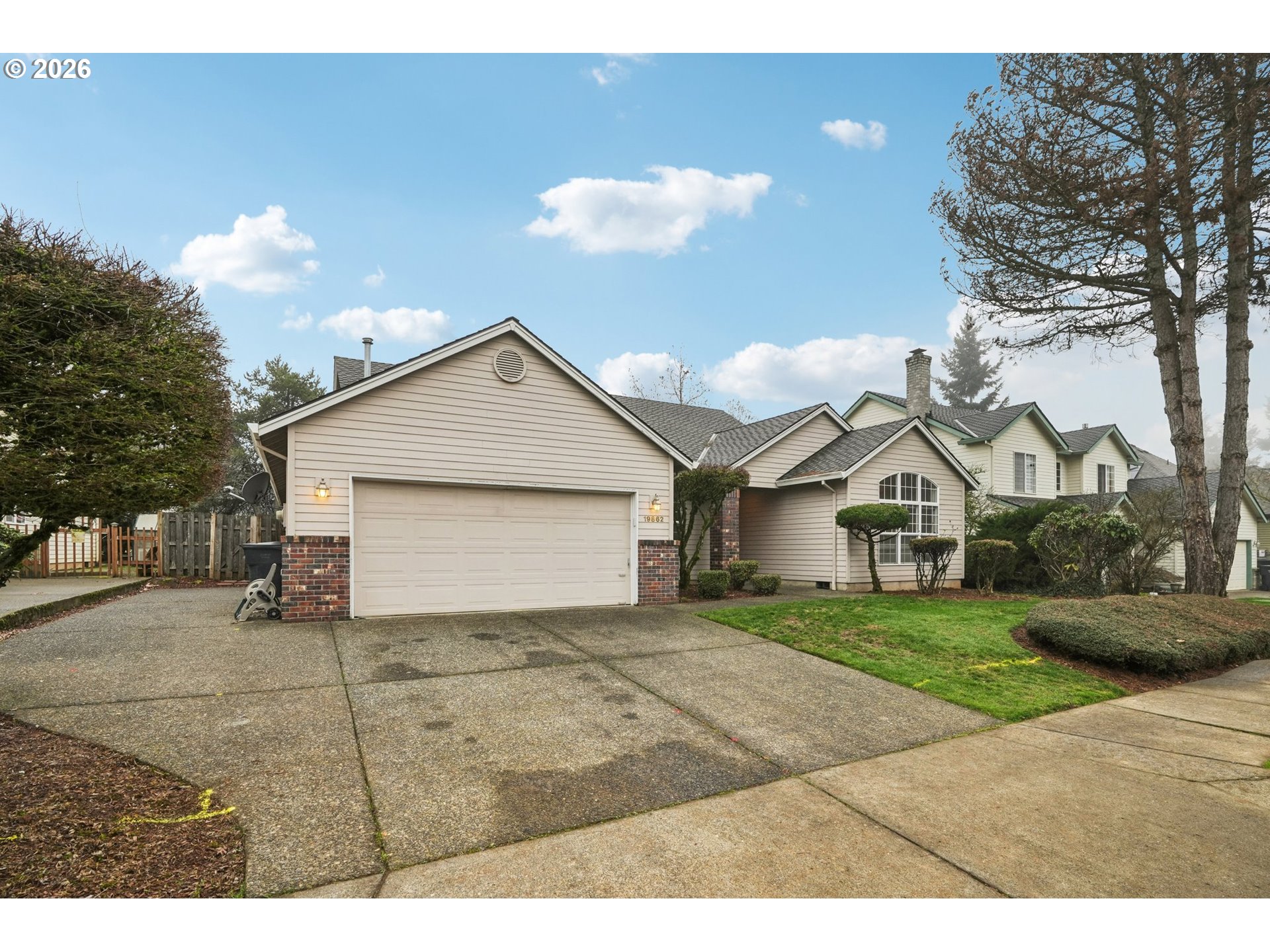 19862 Castleberry Loop Oregon City, OR 97045 - Photo 32 of 33 a view of a house with a yard and garage