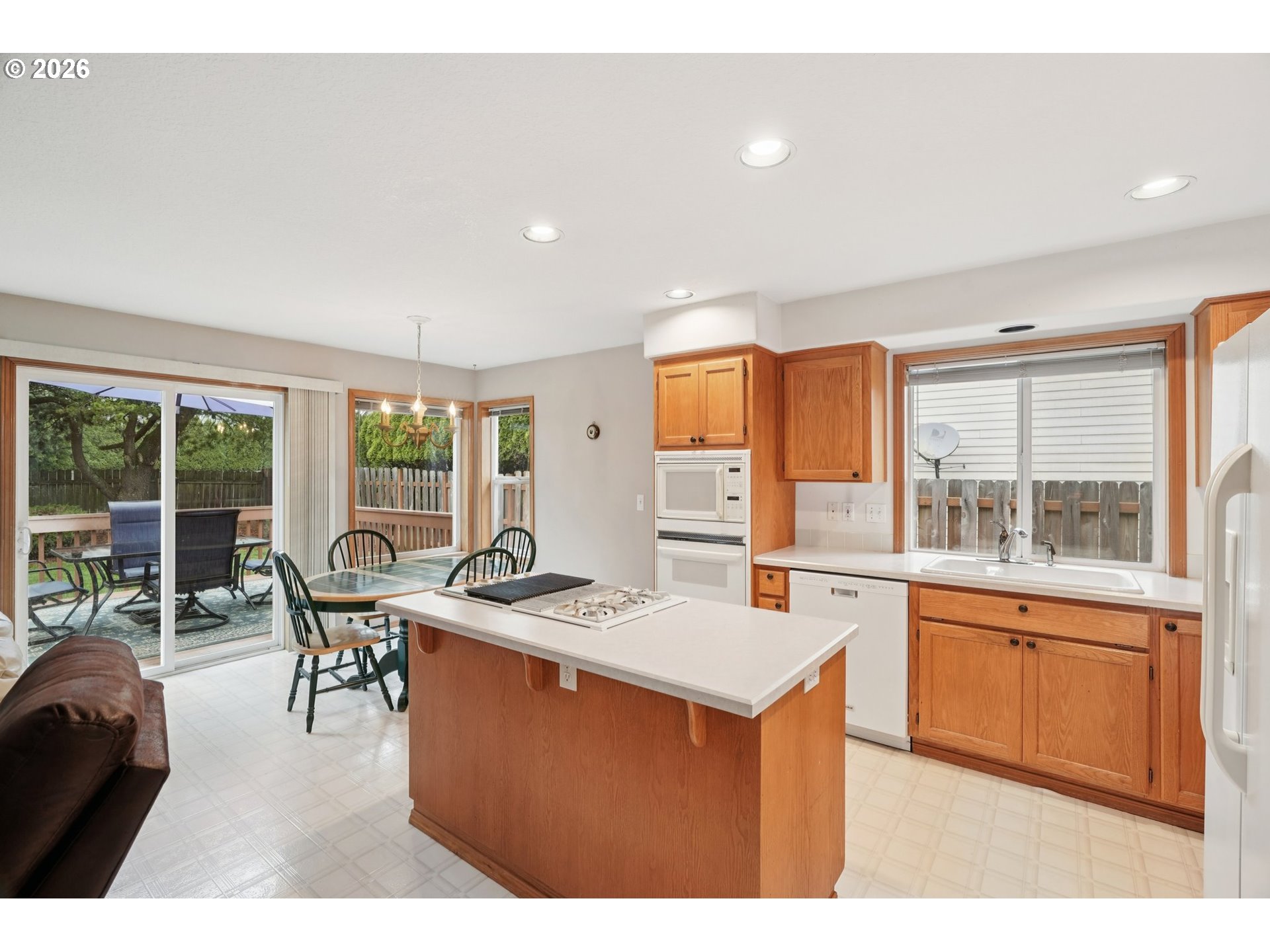 19862 Castleberry Loop Oregon City, OR 97045 - Photo 5 of 33 a dining hall with stainless steel appliances granite countertop a sink and a large window