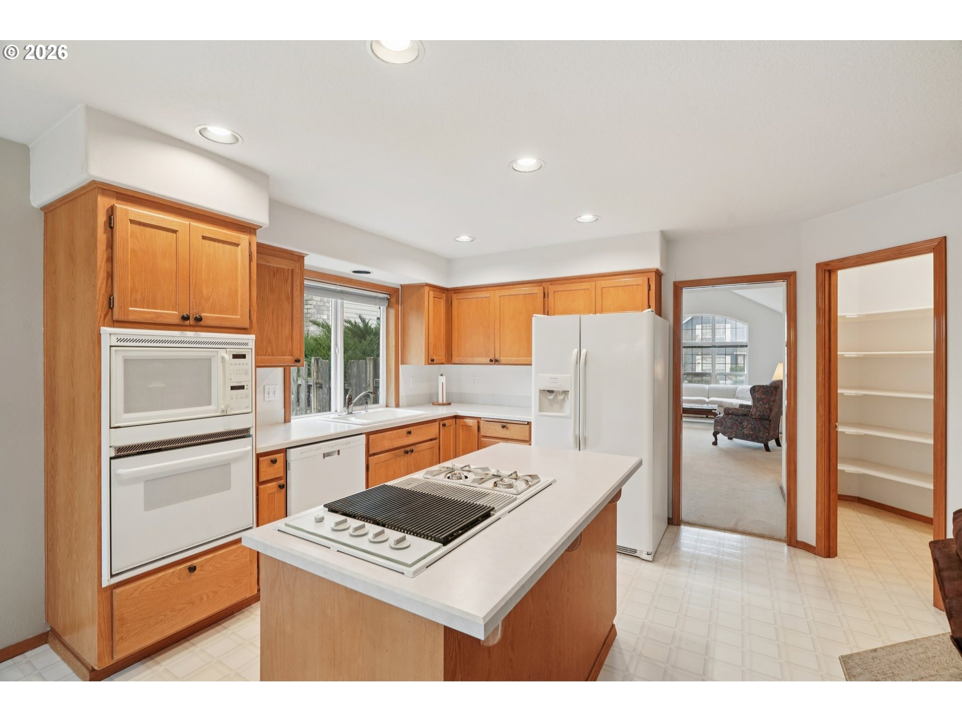 19862 Castleberry Loop Oregon City, OR 97045 - Photo 6 of 33 a kitchen with stainless steel appliances granite countertop a refrigerator and a sink