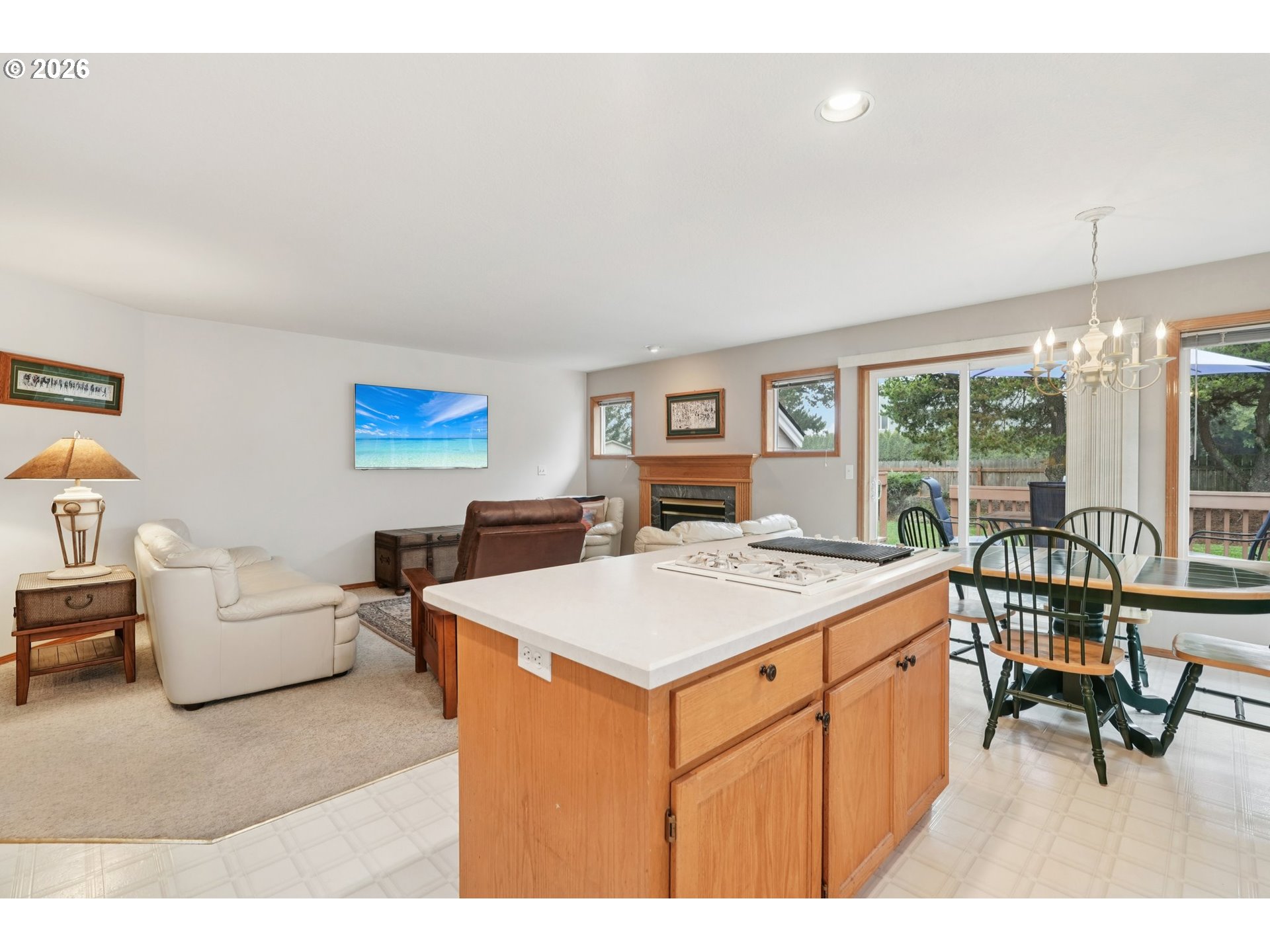 19862 Castleberry Loop Oregon City, OR 97045 - Photo 8 of 33 a living room with furniture a dining table and a floor to ceiling window