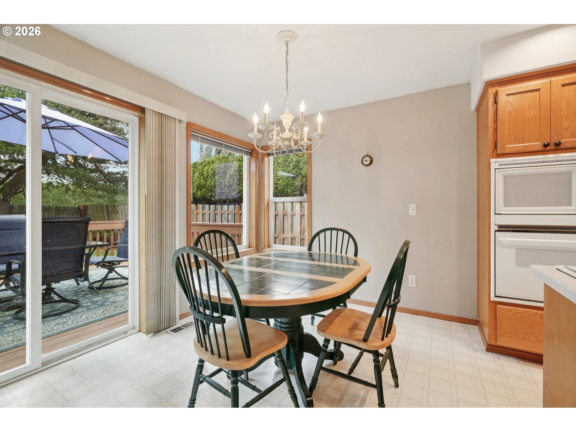 19862 Castleberry Loop Oregon City, OR 97045 - Photo 10 of 33 a dining room with furniture a chandelier and window