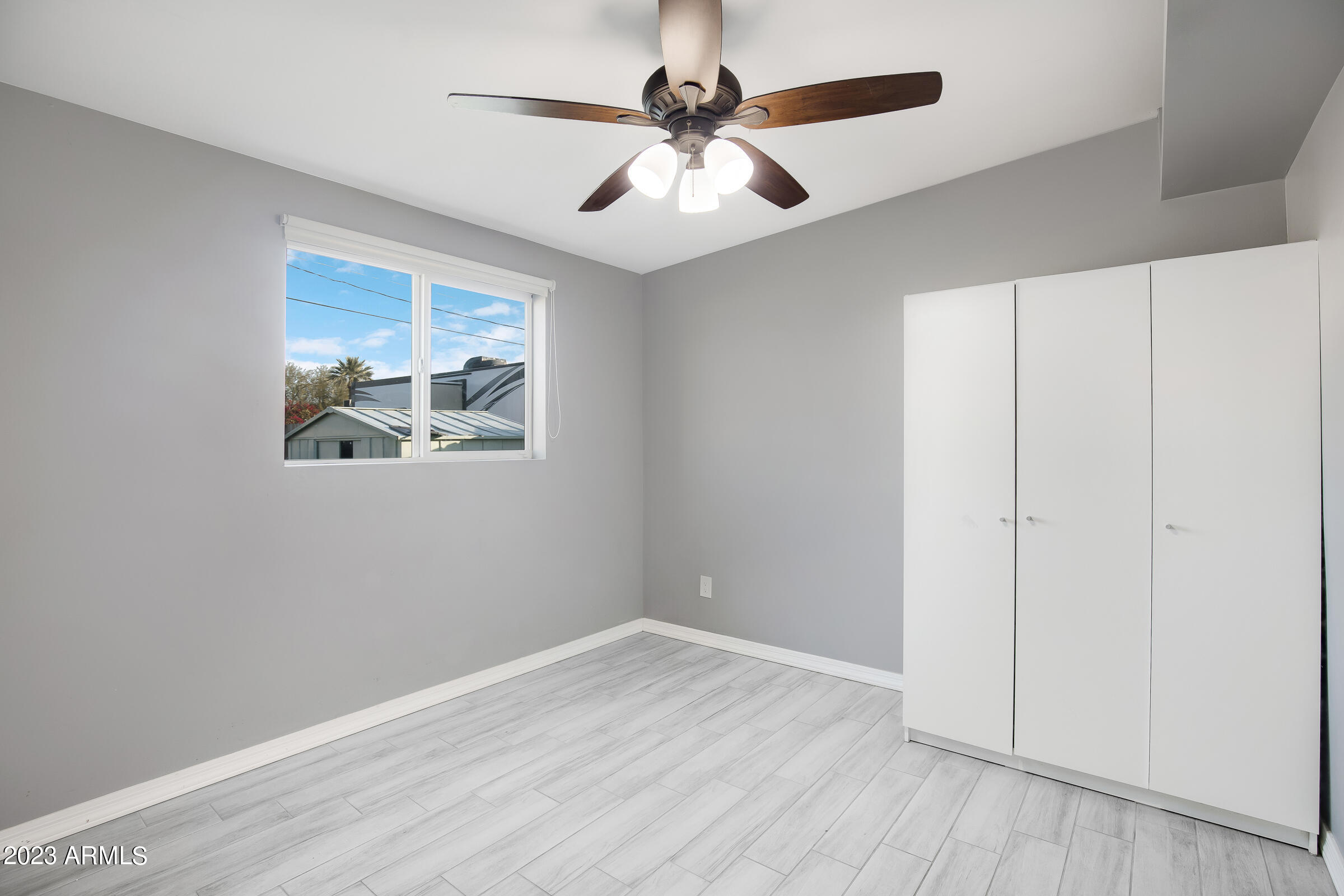 3936 West Granada Road Phoenix, AZ 85009 - Photo 9 of 17 10 bedroom with cabinet