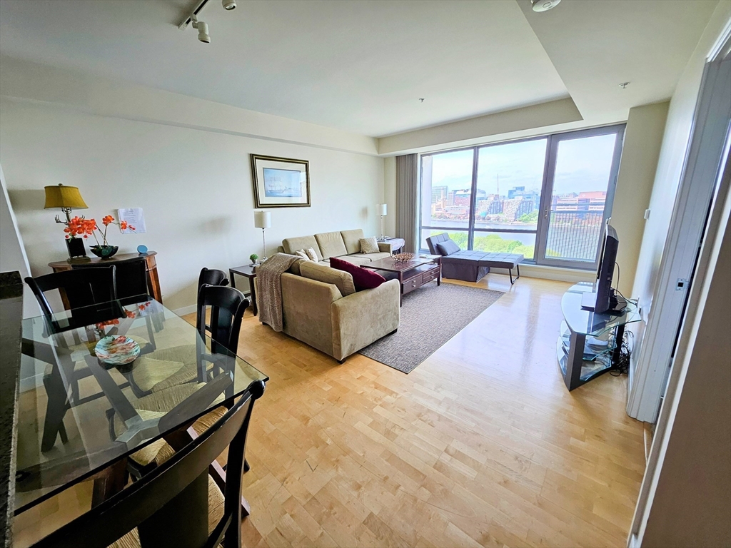 175 Blossom Street, Unit 2 Boston, MA 02114 - Photo 4 of 4 a living room with furniture and a large window