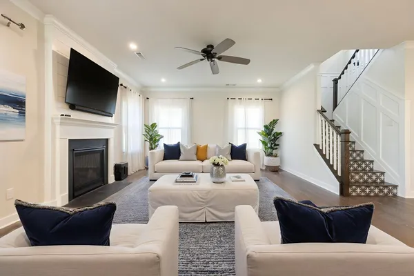 a large kitchen with stainless steel appliances kitchen island granite countertop a large counter top and wooden floors