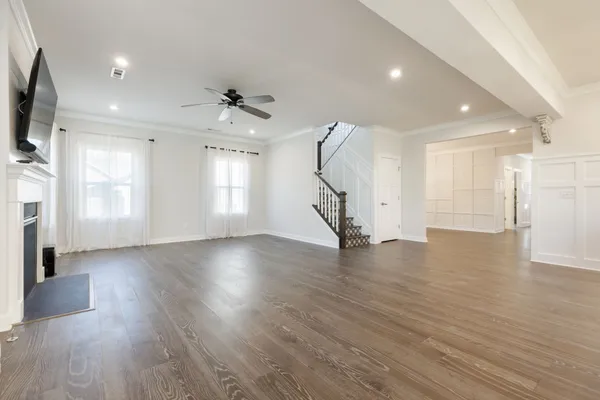 a kitchen with kitchen island a sink appliances and cabinets