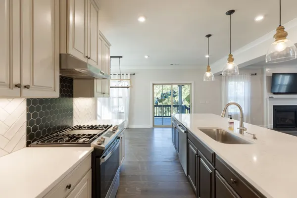 a bathroom with double sink and a mirror
