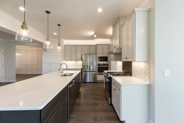 a bathroom with double sink and two mirror