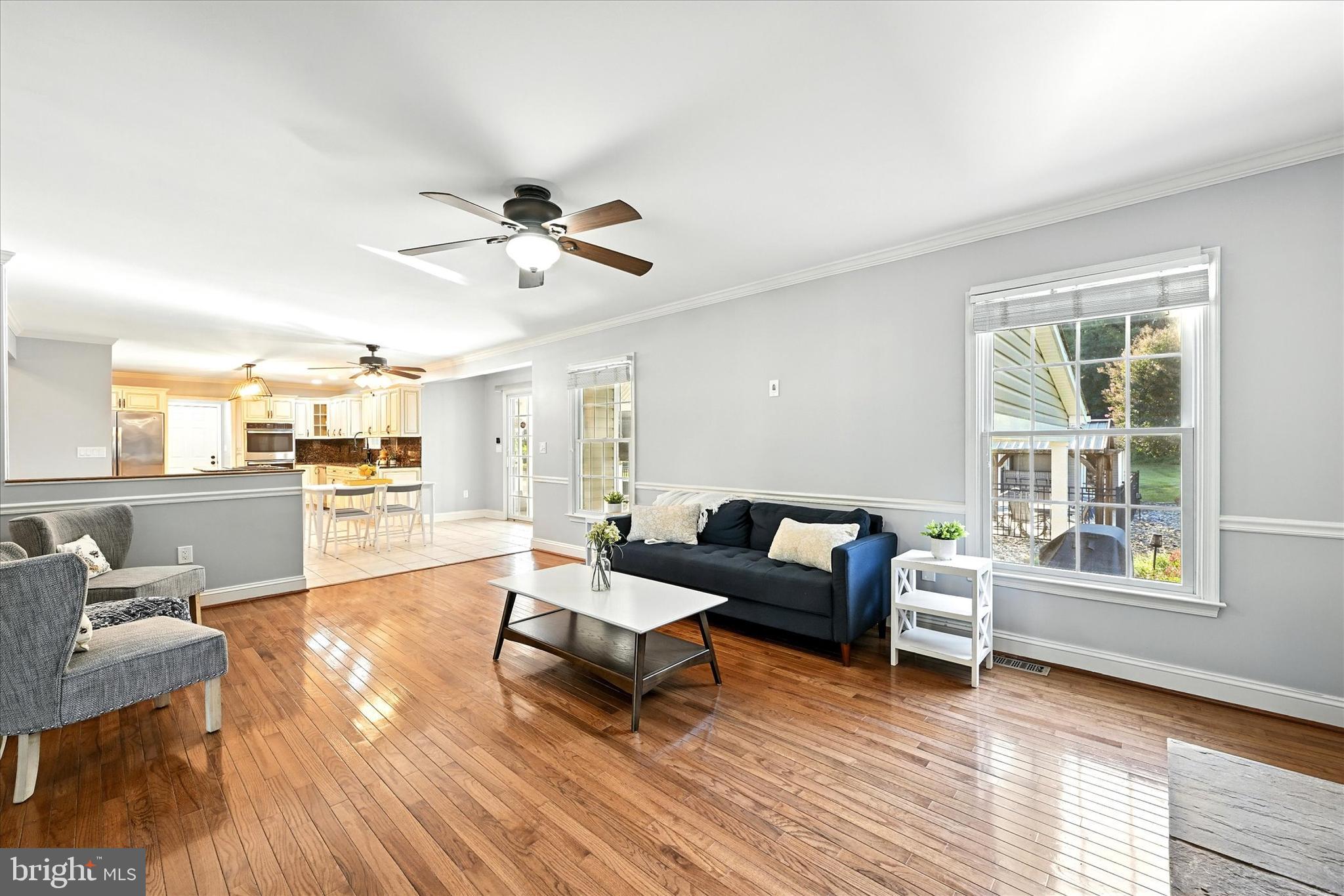 1014 Bernoudy Road White Hall, MD 21161 - Photo 15 of 73 a living room with furniture and a wooden floor