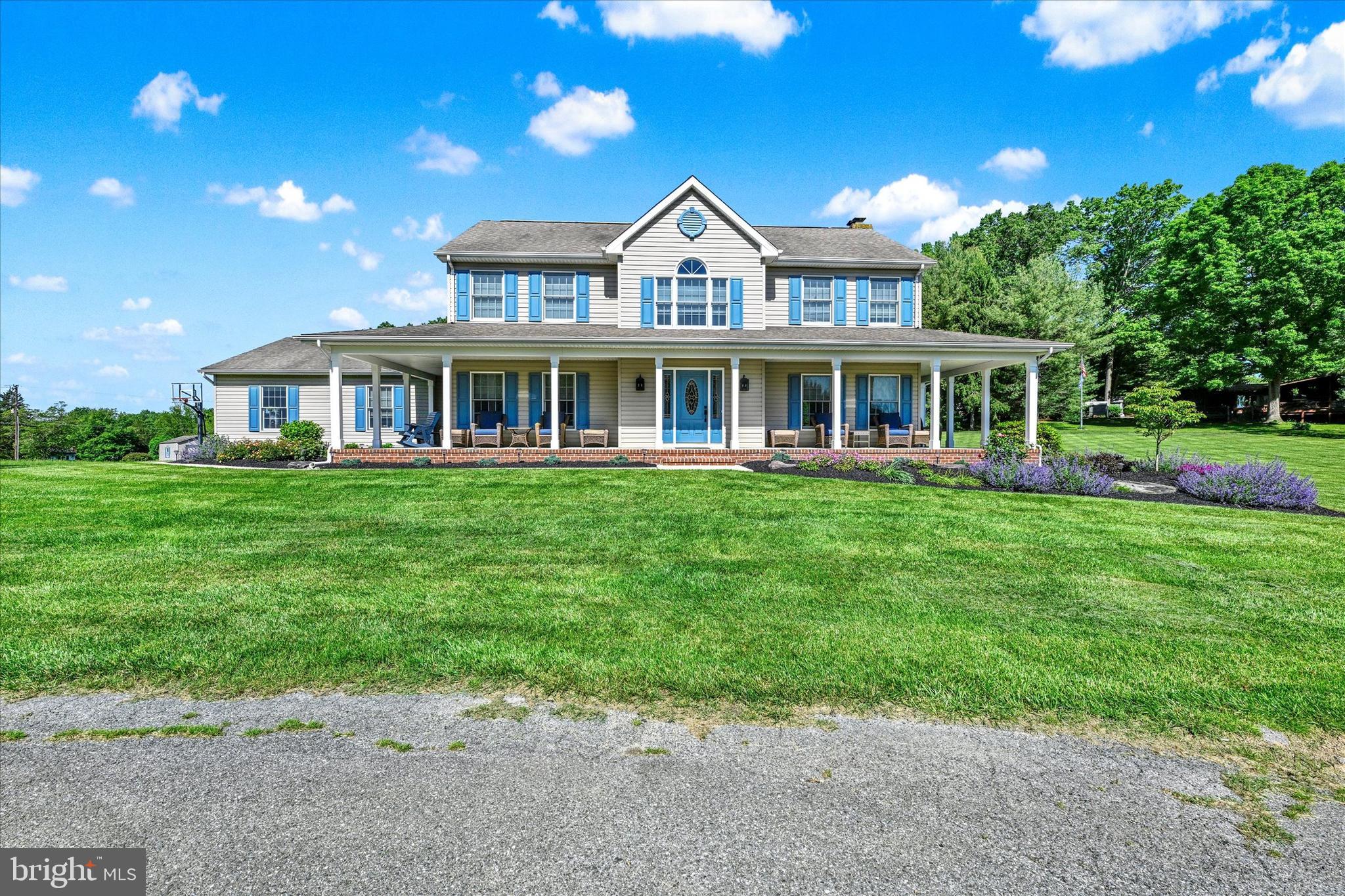 1014 Bernoudy Road White Hall, MD 21161 - Photo 2 of 73 a front view of a house with a yard table and chairs
