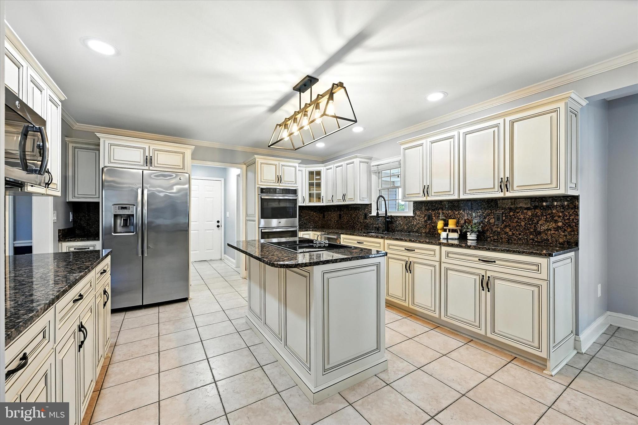 1014 Bernoudy Road White Hall, MD 21161 - Photo 21 of 73 a kitchen with stainless steel appliances granite countertop a stove a sink and a refrigerator