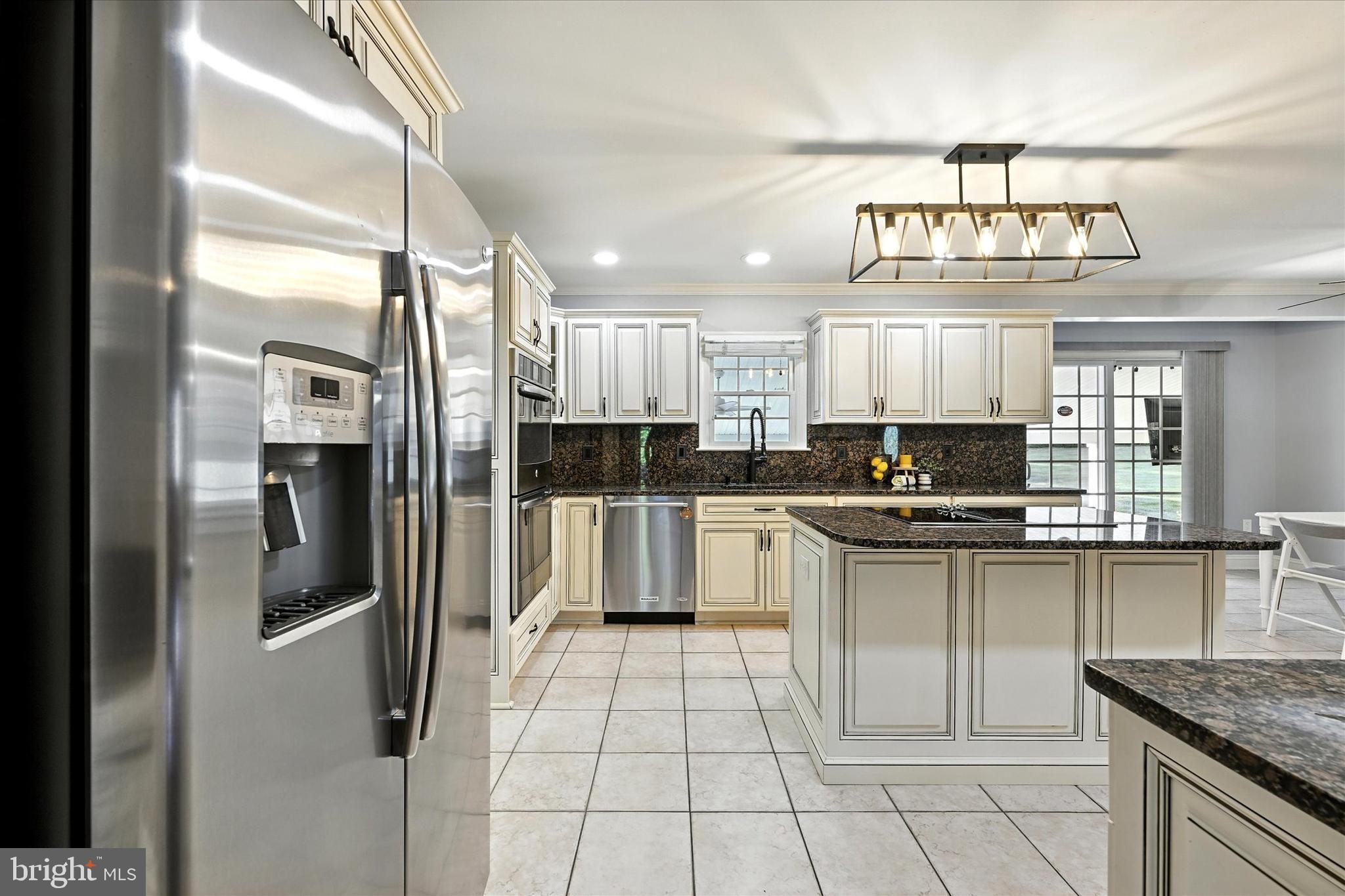 1014 Bernoudy Road White Hall, MD 21161 - Photo 24 of 73 a kitchen with stainless steel appliances granite countertop a refrigerator and a sink