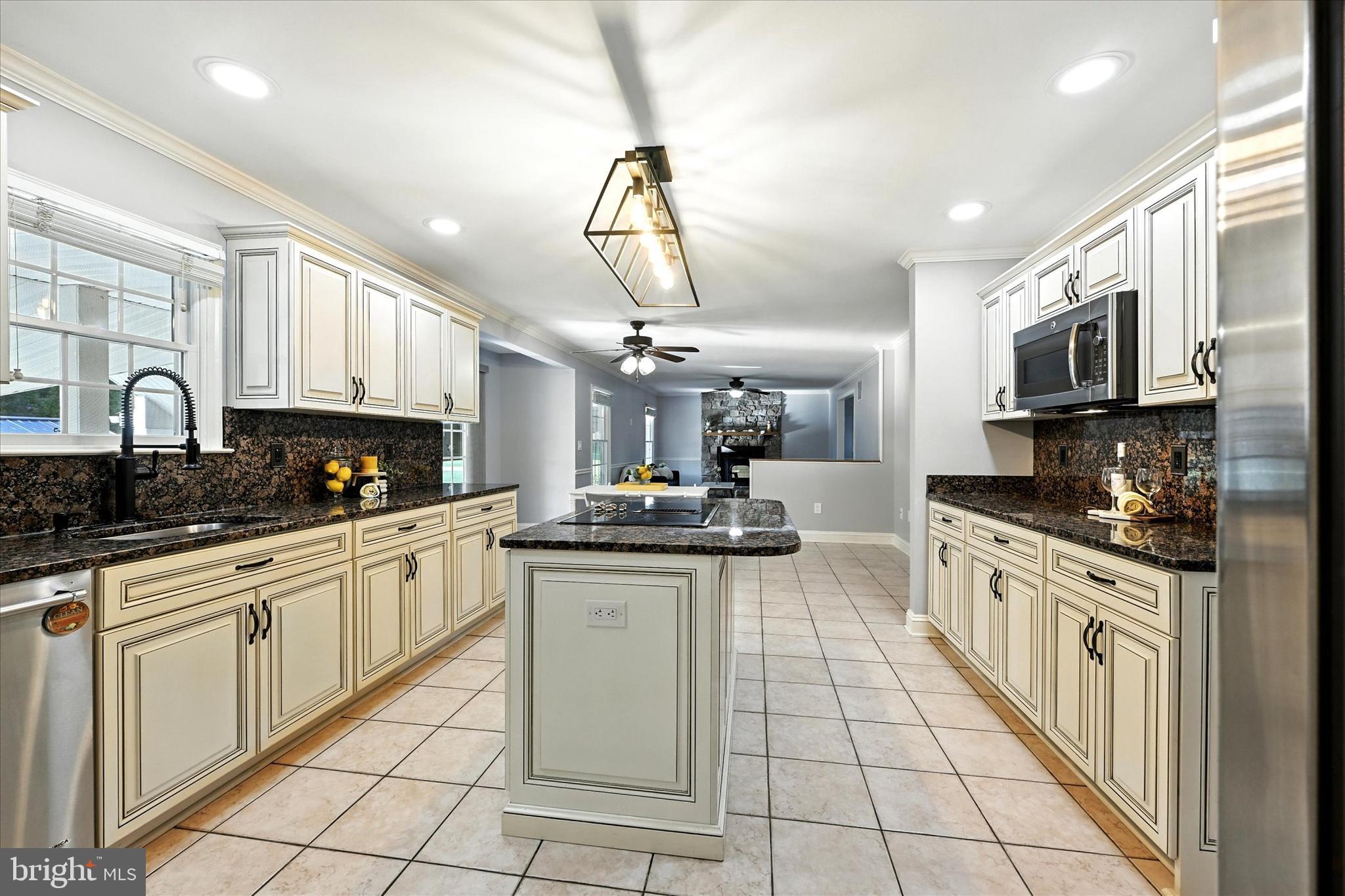 1014 Bernoudy Road White Hall, MD 21161 - Photo 25 of 73 a large kitchen with stainless steel appliances granite countertop a sink and cabinets