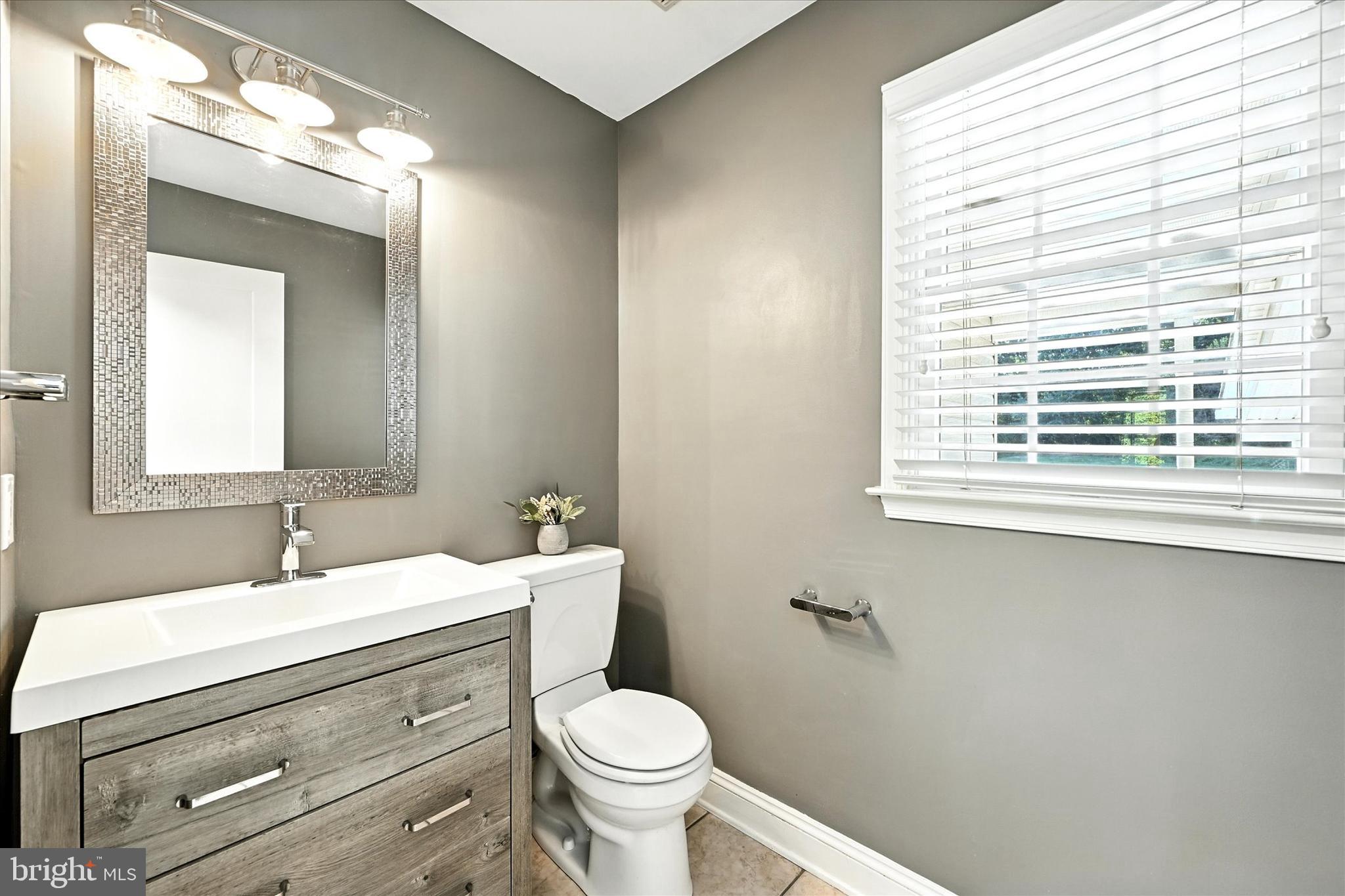 1014 Bernoudy Road White Hall, MD 21161 - Photo 26 of 73 a bathroom with a toilet sink and mirror