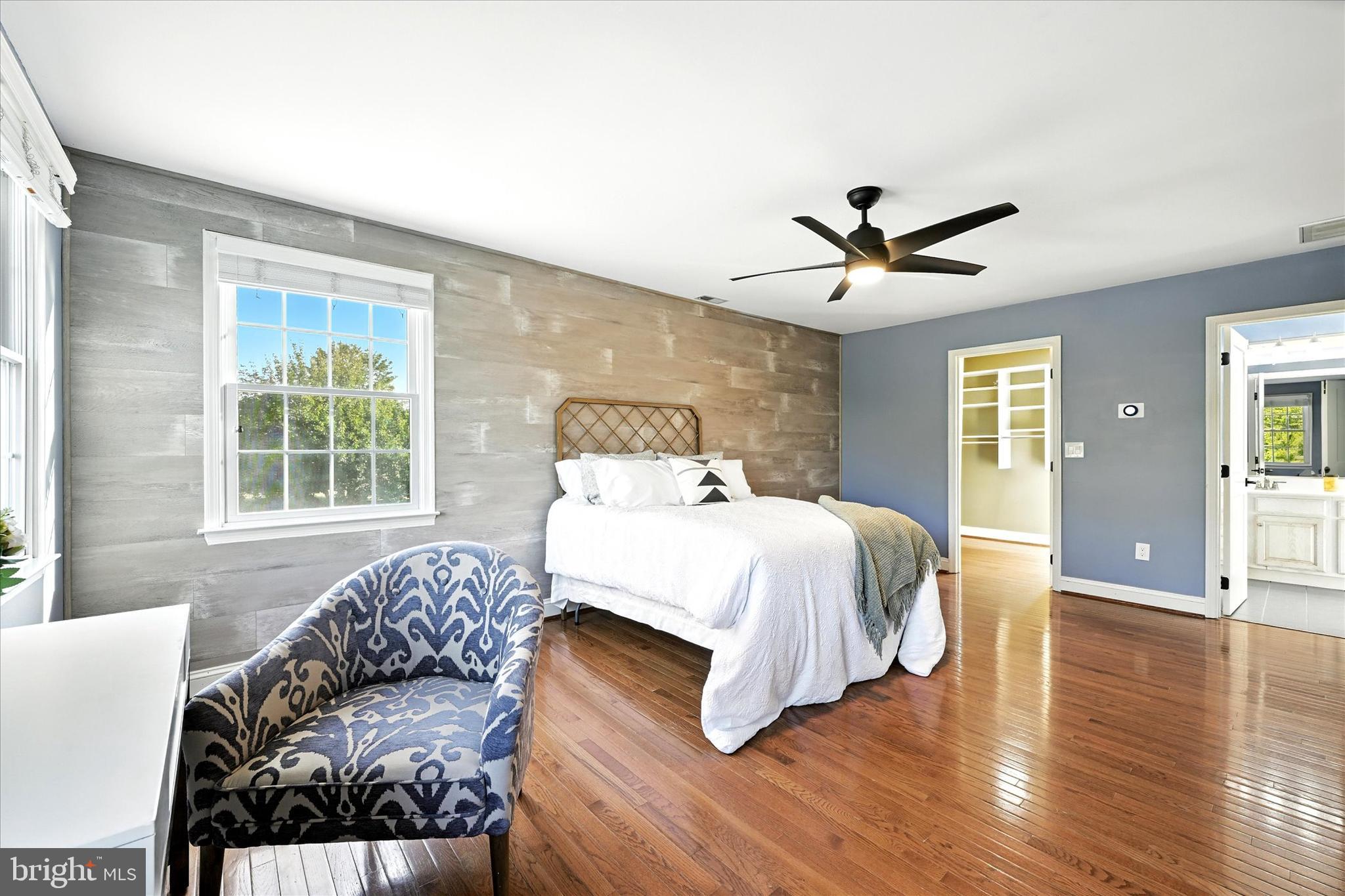 1014 Bernoudy Road White Hall, MD 21161 - Photo 31 of 73 a spacious bedroom with a bed and wooden floor