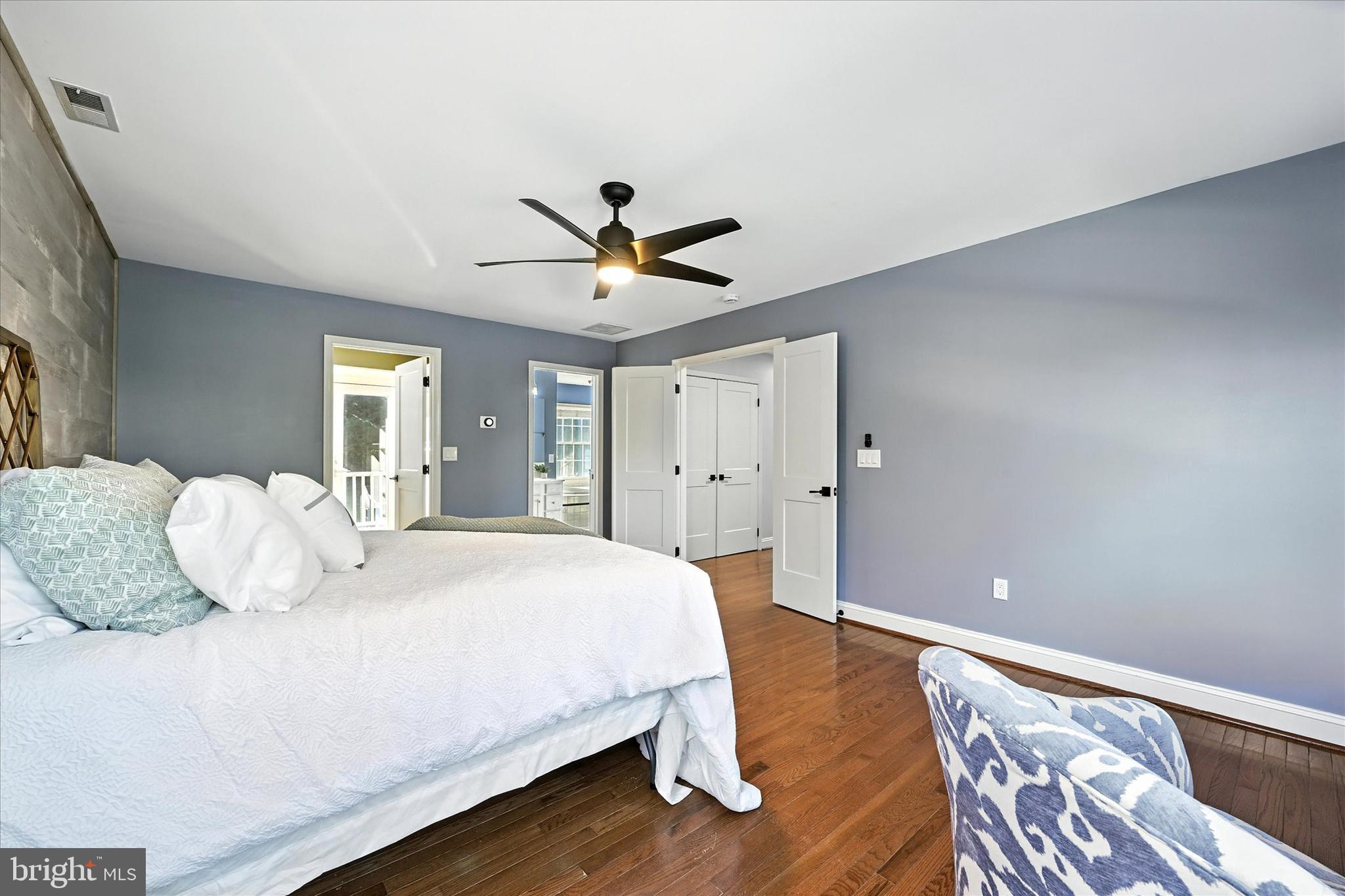 1014 Bernoudy Road White Hall, MD 21161 - Photo 32 of 73 a bedroom with a large bed and a chandelier
