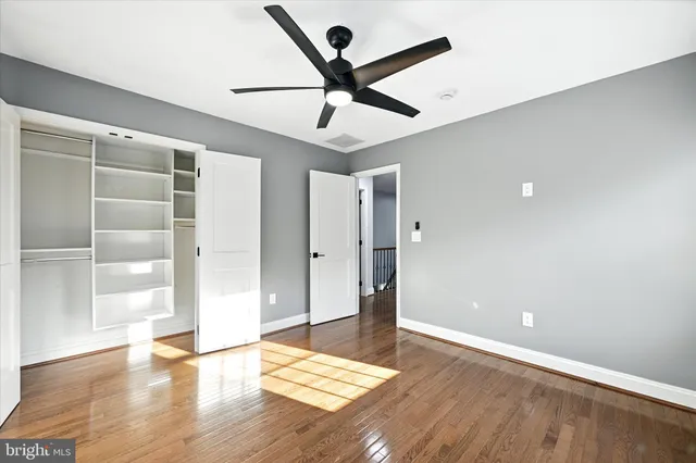 an aerial view of a house with a garden and swimming pool