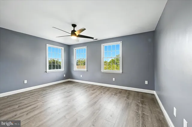 an aerial view of a house with a garden and trees