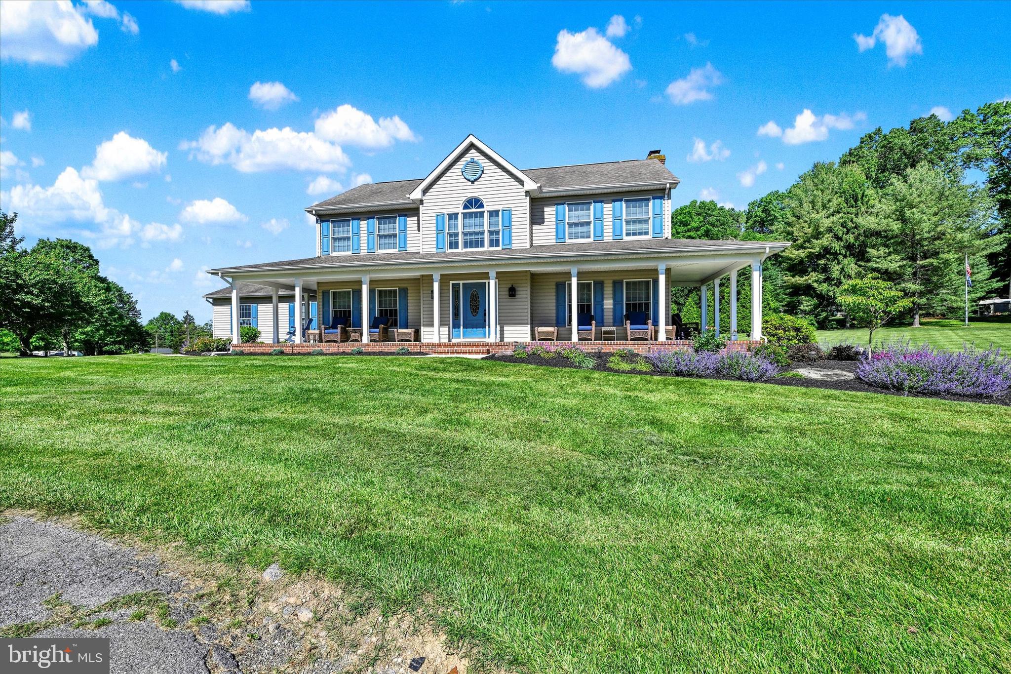 1014 Bernoudy Road White Hall, MD 21161 - Photo 4 of 73 a front view of a house with a yard table and chairs