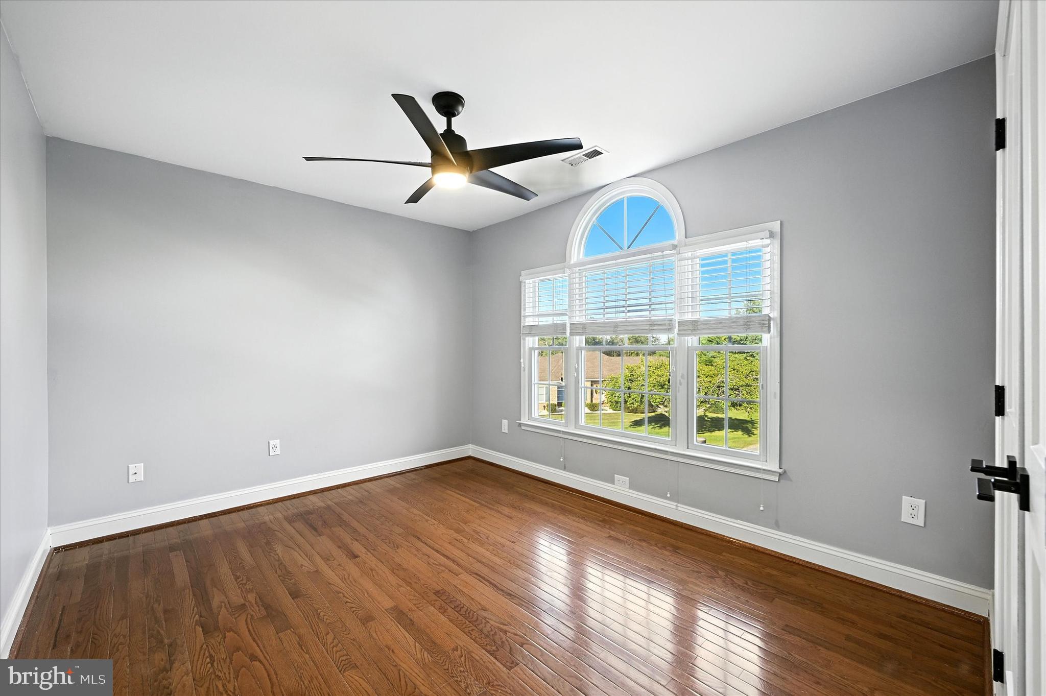 1014 Bernoudy Road White Hall, MD 21161 - Photo 41 of 73 an empty room with wooden floor fan and windows