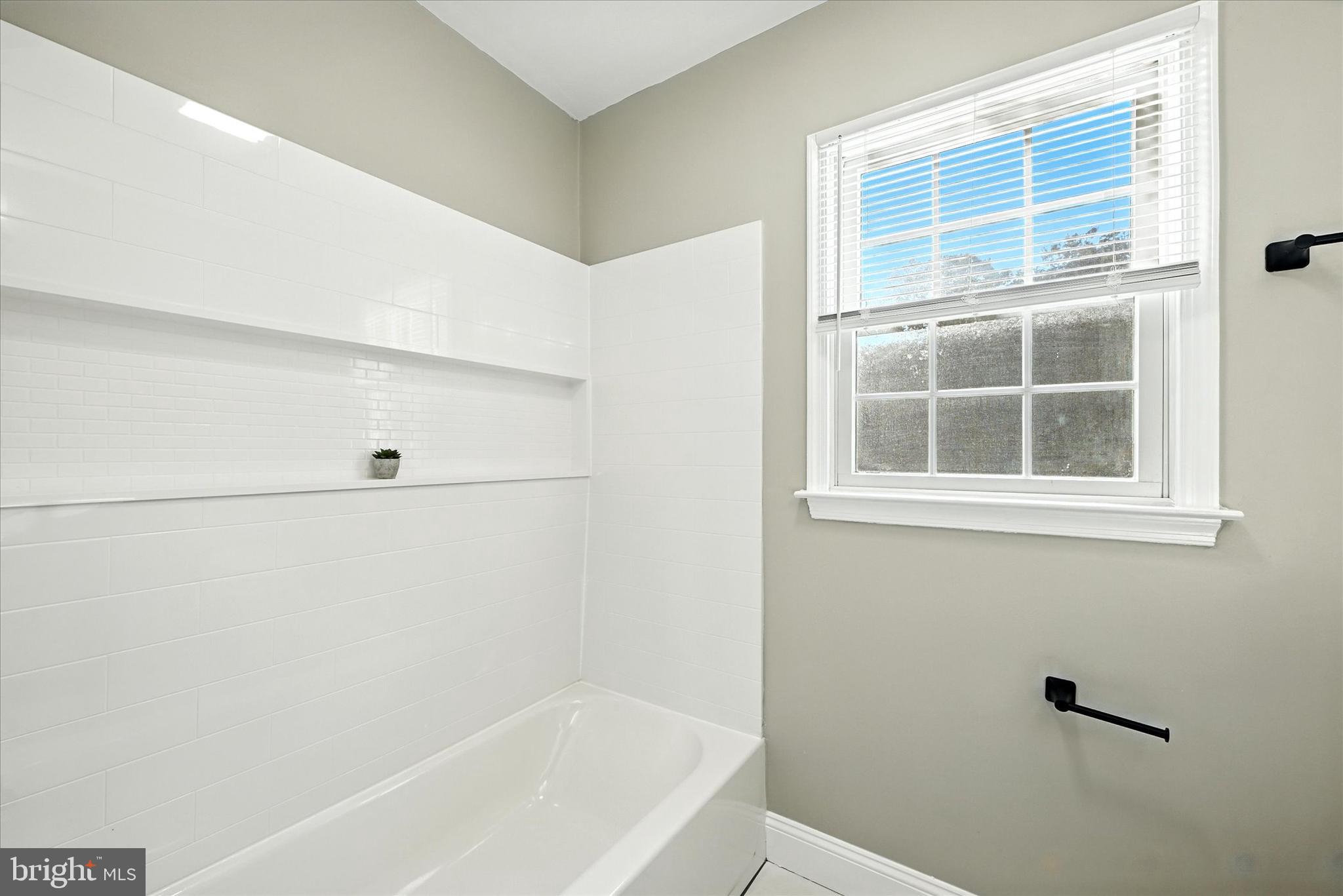 1014 Bernoudy Road White Hall, MD 21161 - Photo 43 of 73 a bathroom with a bathtub