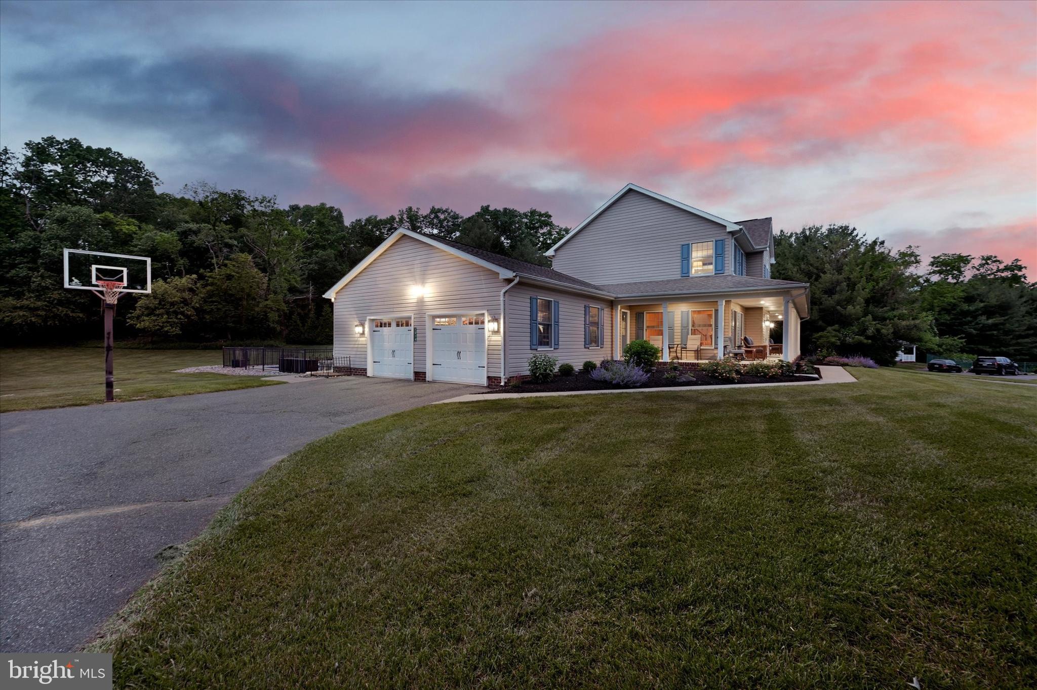 1014 Bernoudy Road White Hall, MD 21161 - Photo 67 of 73 a front view of a house with a yard and garage
