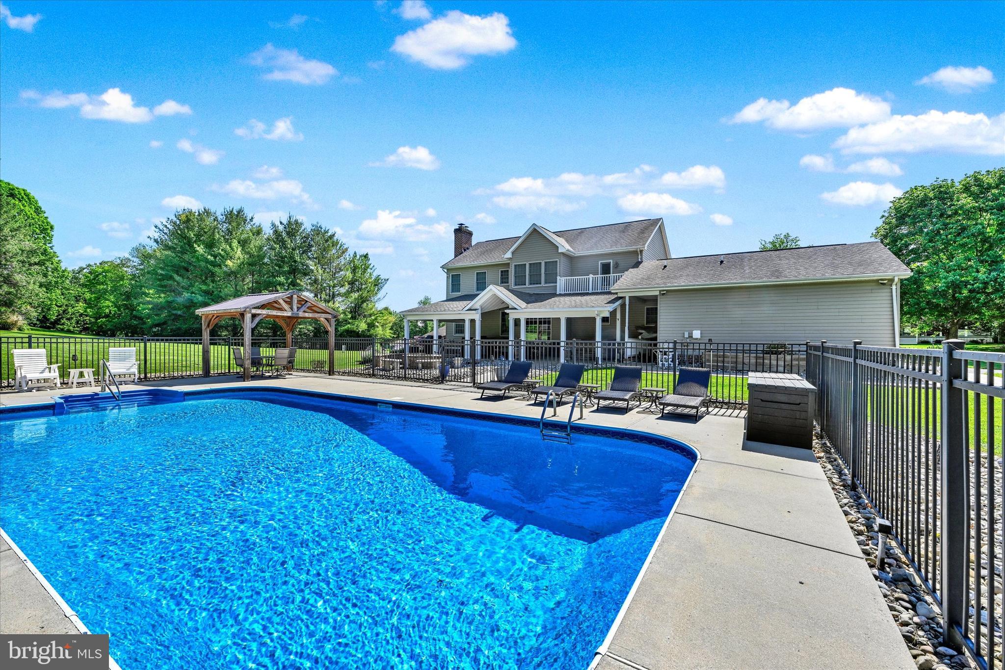 1014 Bernoudy Road White Hall, MD 21161 - Photo 9 of 73 a view of a patio with swimming pool having outdoor seating