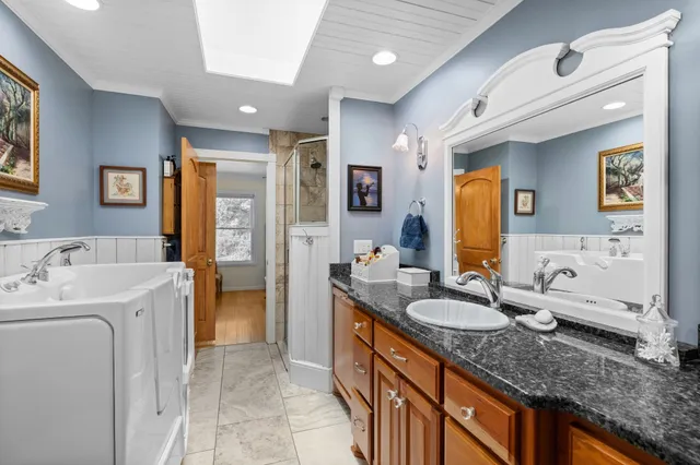 a bedroom with a bed and a mirror