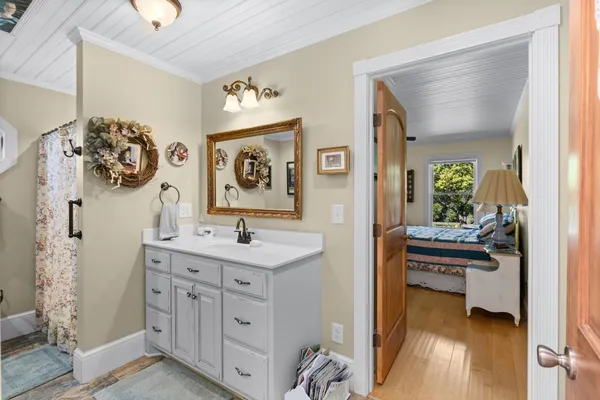 a bedroom with a bed and a table in it