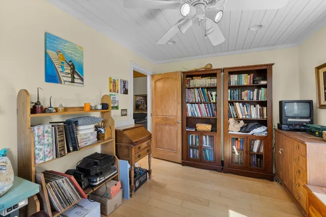 a building outdoor space with patio furniture and potted plants