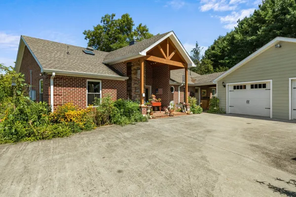 a backyard of a house with lots of green space