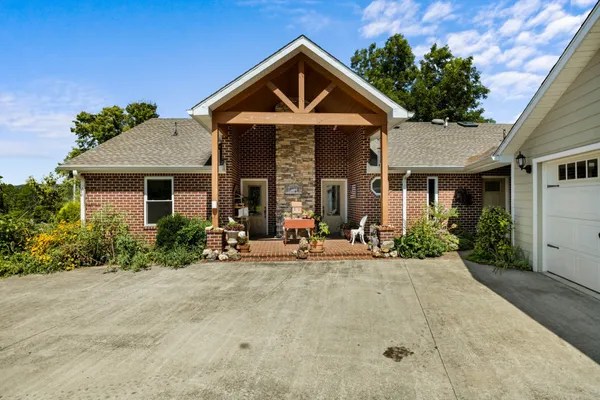a front view of a house with garden