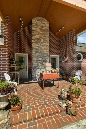 a living room with a outdoor seating space and a potted plant