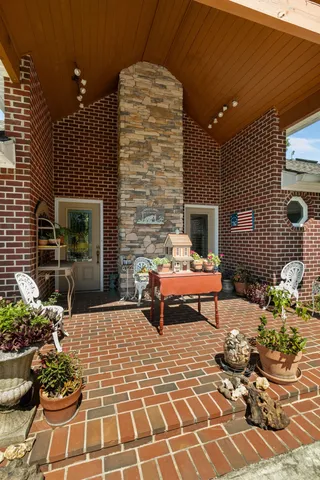 a living room with a outdoor seating space and a potted plant